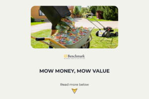 A man mowing a lawn, with a wheelbarrow of money in the foreground